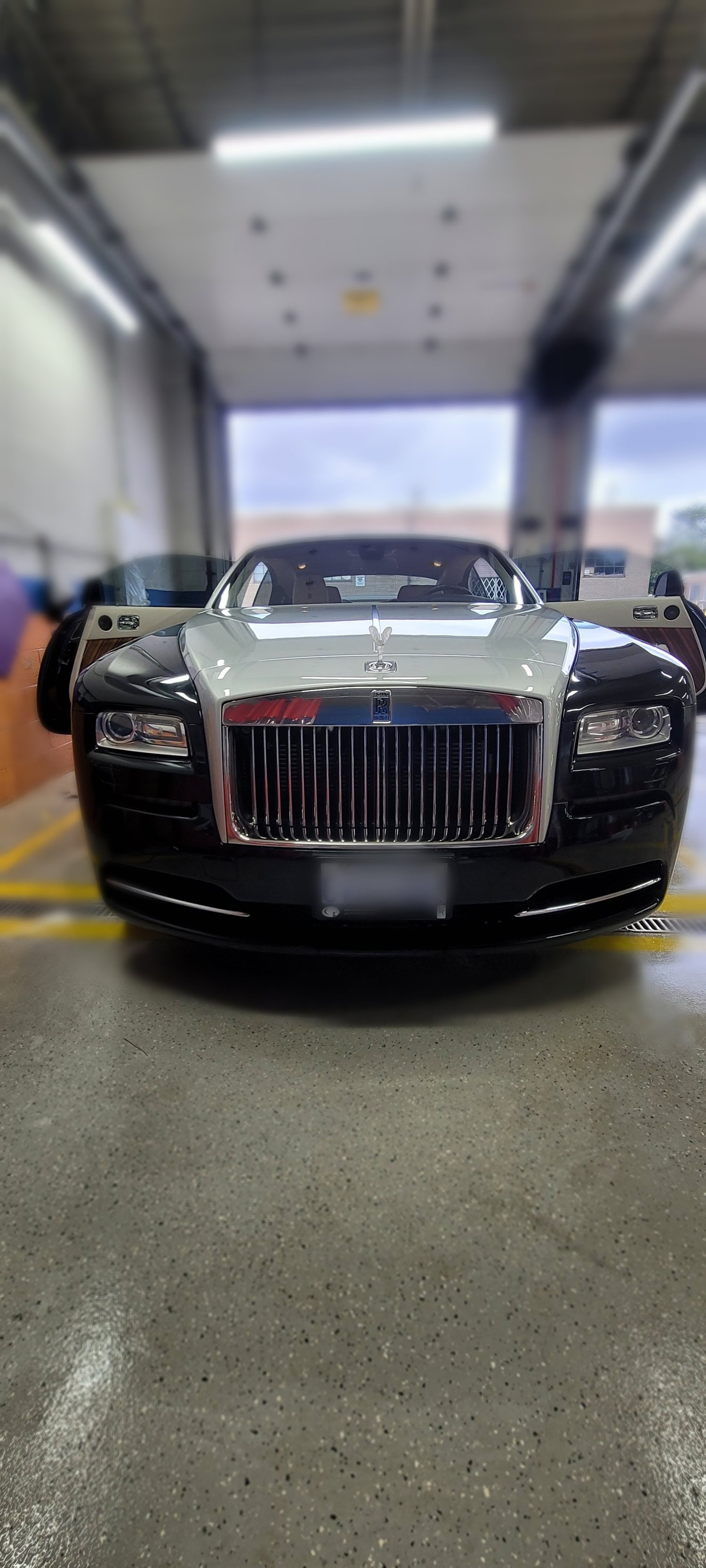 Rolls-Royce receiving care at the Troy Detailing Solutions shop